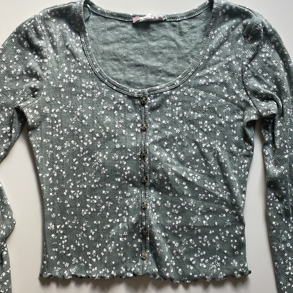 Floral green shirt.